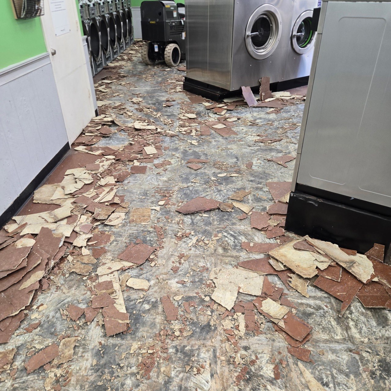 Laundromat floor tile demolition