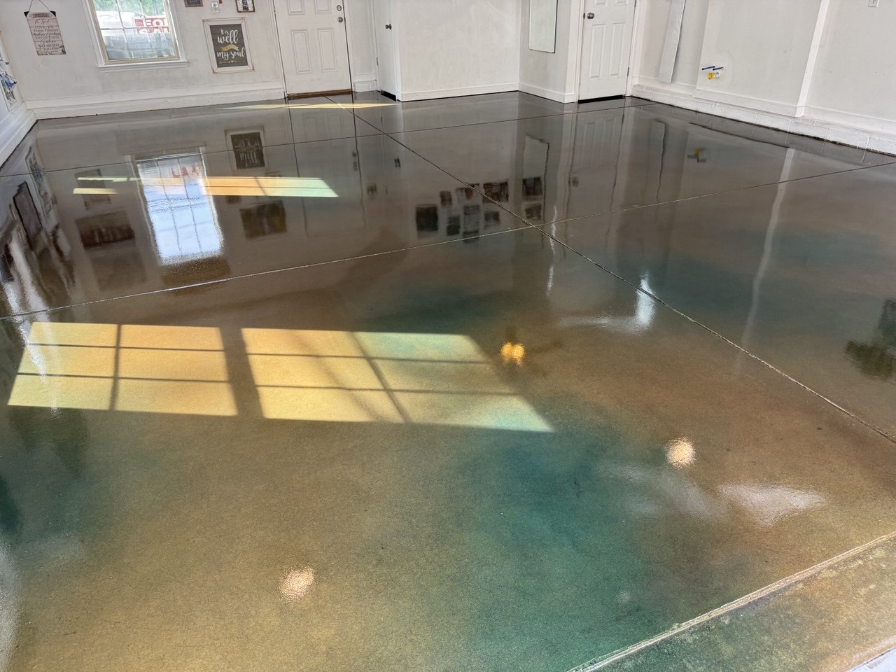 Teal stained concrete garage floor